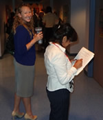 participants looking at research poster